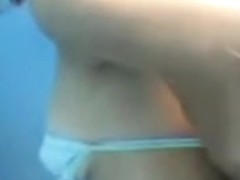 Dark nippled tits were voyeured in the beach cabin