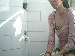 Spying on this female in bathroom while pissing