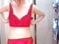 Redhead Asian trying on erotic costume in change room