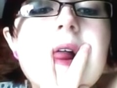 Nerdy busty teen with glasses fingers her slit