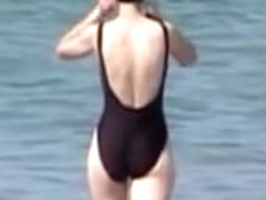 Hot housewife is wearing black candid swimsuit on beach 07y