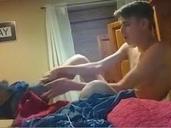 Gorgeous gay boy cums fingering his tight ass on cam