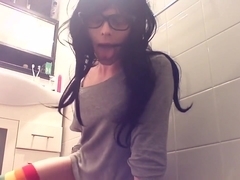 nerdy hipster transgirl covering herself in lube