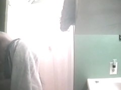 Flashing her boobs and her pussy in shower on spy cam