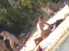 Only on a nudist beach you can spy on naked people all day long