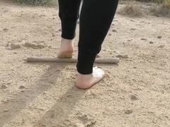 Super slow motion feet walking on dusty ground -- DIRTY FEET