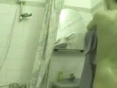 Sexy chick caught on a shower voyeur video