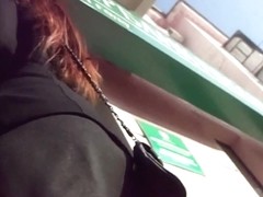 Perverted voyeur following a girl and filming her