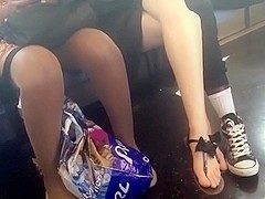 Candid crossed legs and thong sandal feet