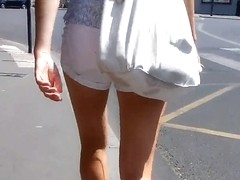beautifull legs walking in the street in mini shorts