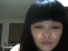 Chinese girl plays with her hairy pussy