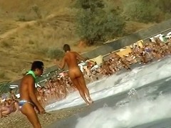 Lush bodied MILF parades before a nude beach voyeur