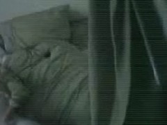 A hot chick masturbating in her bed