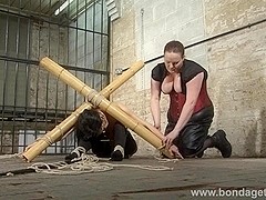 Submissive Elise Graves in japanese style bamboo bondage and lesbian domination of restrained dams.