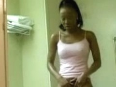 Darksome chick touching her snatch in the bathroom