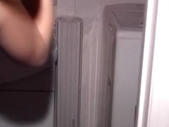 Asian schoolgirl having two cocks to suck inside the bathroom