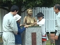 Busty Japanese whore in a kinky public display