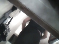 Chubby fem in black pants and bra in dressing room spy vid