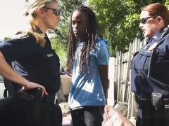 Officers arrest a criminal and subdue him into giving their pussies cock