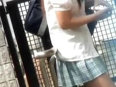 Tight little Asian bimbo gets spanked while taking street walk