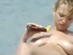 Aroused beach voyeur films big tits