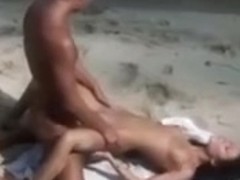 Smoking hot sex on the beach with young couple