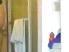 Hidden camera recorded a small tittied girl in the shower