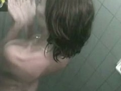 Slender brunette sweetie caught on a hidden shower cam