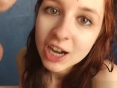 Sweet redhead gives sloppy blowjob in the shower