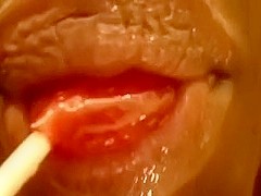Check out wet glossed soft lips sucking a lollipop