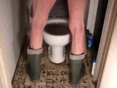 nlboots - dunlop boots on toilet while smoking & pissing