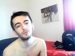 Sexy fag is having fun in the guest room and filming himself on web camera
