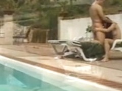 Chick cools off by the pool