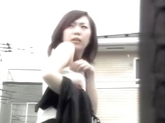 Gorgeous Asian babe boob sharked on a parking lot.