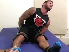 Muscular hunk endures tickling torment completely naked