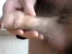 20s lad stroking his long foreskin covered cock