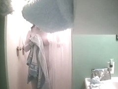 An alluring bimbo caught on a spy cam in the shower
