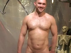 Restrained BDSM stud teased with sextoy