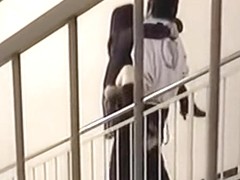 Horny Asian couple having sex on the stairs at the entrance