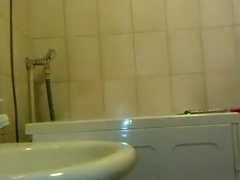 Fat boy wanking and looking his face from the mirror