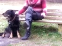 Tranny sitting on Parkbench near road