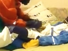 Raingear buddies play on ottoman