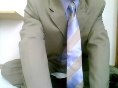 Stroking in dress, tie and socks