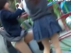 Two schoolgirls in the park getting skirt sharked by one guy