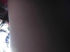 Public upskirt view presents charming red panties