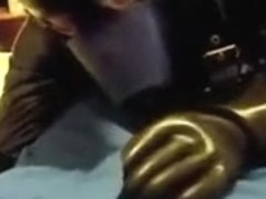 Rubber doggie servicing a coverall chap