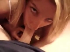 Blonde lovely gal sucking 10-Pounder and gets sprayed with cum on her face