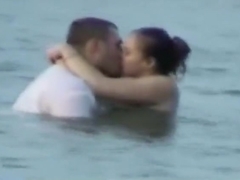 Voyeur tapes a horny couple having sex in the sea