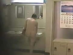 Absolutely naked amateur is spied on changing room spy cam