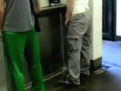 Duo inside public toilet